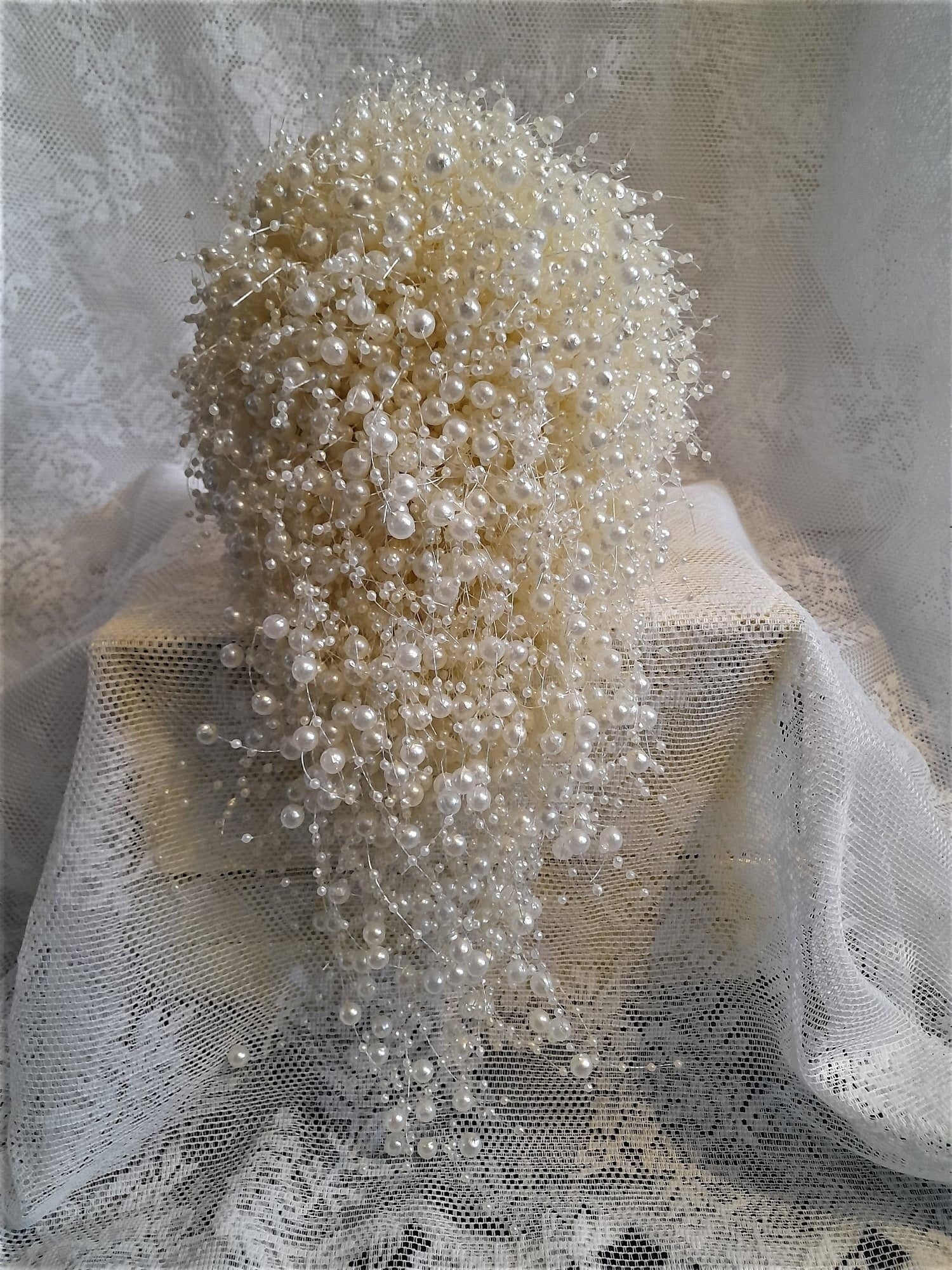 Ivory Pearl Waterfall Bouquet on a lace background