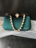 Green clutch with decorative chain and your text on a black background