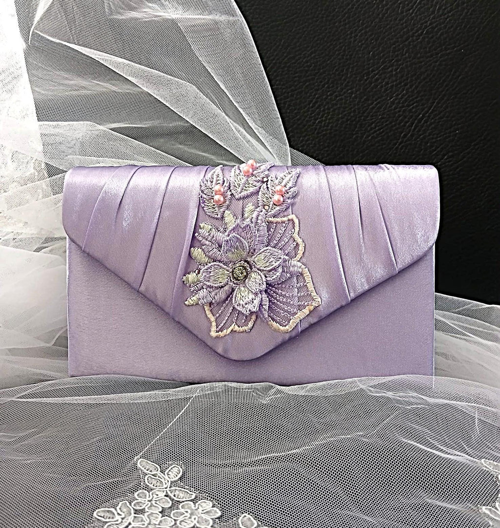 Lavender clutch with floral embroidery on a sheer fabric background