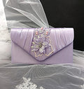 Lavender clutch with floral embroidery on a sheer fabric background