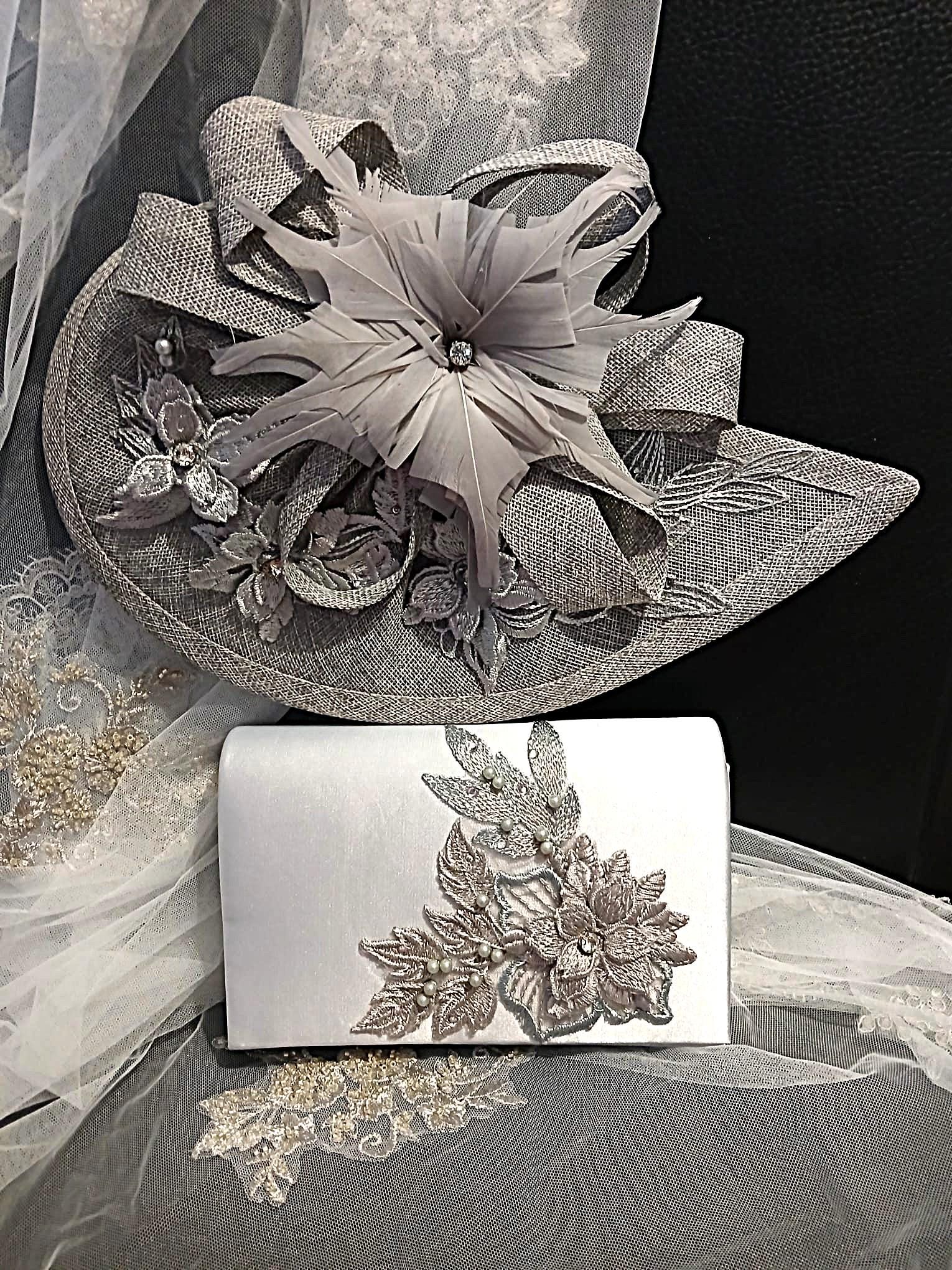 Silver Grey hat and clutch with floral embellishments on a black background