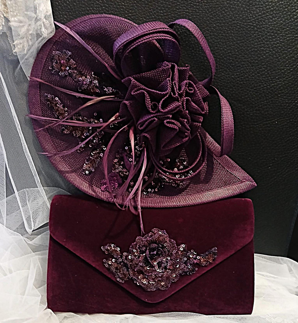 Purple fascinator and matching clutch bag with floral embellishments on a white and black background.