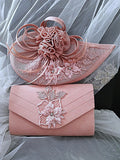 Pink handbag and hat with floral embroidery on a sheer fabric background